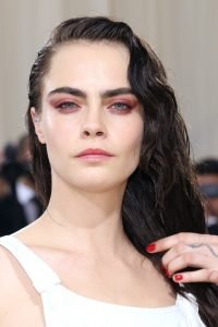 Cara Delevigne the supermodel with glowing, glass-looking skin.