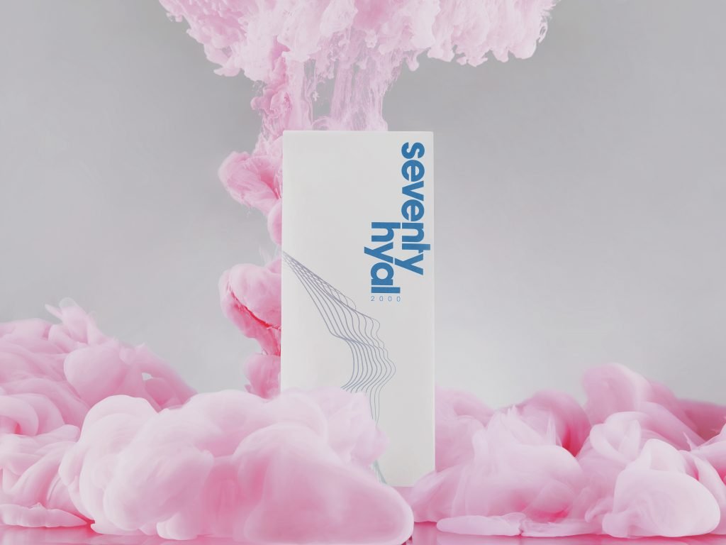 2023 skincare trends: Box of Seventy Hyal 2000 on a grey background, surrounded by pink ink.